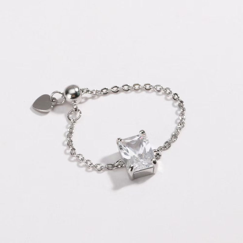 Adjustable micro-paved diamond ring with clear square gemstone on silver chain