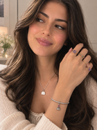 Assorted rings, bracelets, and a heart pendant necklace in gold and blue