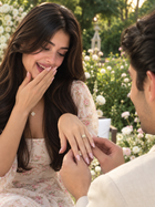 Bridal ring set with small sparkling stones worn on hand with slender band