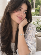Gold braided pearl cuff bracelet with round light-blue center detail