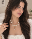 White pearl necklace with star pendant and small pearl drops